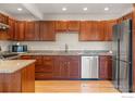 Well-lit kitchen features granite countertops, stainless steel appliances, and hardwood floors at 319 Camino Bosque, Boulder, CO 80302