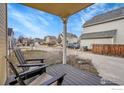 Relaxing front porch featuring comfortable seating and a view of the street at 740 Boxwood Ln, Longmont, CO 80503