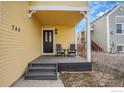 Inviting front porch with seating, perfect for relaxing and enjoying the neighborhood views at 740 Boxwood Ln, Longmont, CO 80503