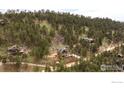 Scenic aerial view of homes surrounded by lush green forest at 93 Pine Needle Rd, Boulder, CO 80304