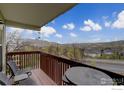 Relaxing balcony with seating area and scenic mountain views in the background at 1203 6Th St # 1203, Golden, CO 80403