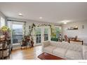 Bright living room with hardwood floors, lots of natural light and access to a balcony at 1203 6Th St # 1203, Golden, CO 80403