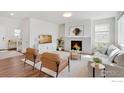 Inviting living room with fireplace, neutral furniture, and bright lighting at 1312 Loraine S Cir, Lafayette, CO 80026