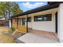 Inviting front porch with stylish accents and a vibrant blue door, adding curb appeal at 1920 S Niagara St, Denver, CO 80224