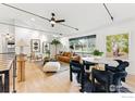 Bright living room with hardwood floors, modern decor, and a large window with natural light at 1920 S Niagara St, Denver, CO 80224