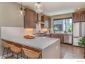 Gourmet kitchen featuring stainless steel appliances, quartz countertops, and a cozy breakfast bar at 2465 Walnut St # 7, Boulder, CO 80302
