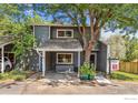 Charming townhome exterior with a large tree and 'For Sale' sign at 2950 Glenwood Dr, Boulder, CO 80301
