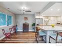 Open concept kitchen with breakfast bar and adjacent dining area at 2950 Glenwood Dr, Boulder, CO 80301