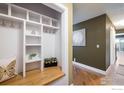 Functional entryway featuring custom built-in shelves and ample storage space for everyday essentials at 2976 Eagle Way, Boulder, CO 80301