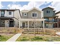 Inviting street view featuring well-maintained homes with quaint picket fences and charming front yards at 320 Marshall Mews, Superior, CO 80027