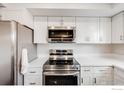 Modern kitchen featuring stainless steel appliances and updated fixtures at 3964 S Yosemite St, Denver, CO 80237