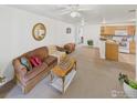 Cozy living room with comfortable seating and an open floor plan at 5425 County Road 32 # 15, Mead, CO 80504