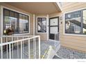 Welcoming front door with decorative rug and outdoor plants, offering curb appeal at 5934 Gunbarrel Ave # D, Boulder, CO 80301