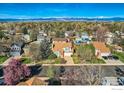 This aerial view showcases a charming neighborhood nestled in a picturesque location near the Rocky Mountains at 719 Cameron Ln, Longmont, CO 80504