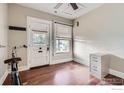 Bright bedroom featuring hardwood floors, a closet, and a large window with natural light at 72 N Pennsylvania St, Denver, CO 80203