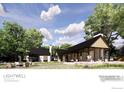 Architectural rendering showcasing a modern home exterior with natural light and inviting outdoor seating at 7929 Valmont Rd, Boulder, CO 80301