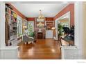 Bright living room with hardwood floors, built-in bookshelves, and a cozy fireplace at 838 University Ave, Boulder, CO 80302