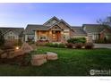 Charming home with well-maintained landscaping, lush green grass, and an inviting entrance at 8392 Niwot Meadow Farm Rd, Niwot, CO 80503