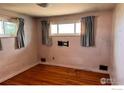 Cozy bedroom with hardwood floors and good light from two windows at 1633 S Alcott St, Denver, CO 80219