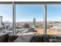 Stunning city views from the comfort of the couch, highlighting the urban landscape at 1700 Bassett St # 1808, Denver, CO 80202