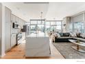 Contemporary kitchen with a large island, stainless steel appliances, and an open layout to the living area at 1700 Bassett St # 1808, Denver, CO 80202
