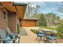 Relaxing outdoor patio with comfortable seating, perfect for enjoying the serene landscape and backyard access at 205 Lipan Way, Boulder, CO 80303