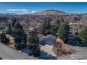 Single-Gathering home featuring mature trees, a spacious driveway, and mountain views at 2605 Crabapple Ct, Golden, CO 80401