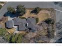 Aerial view of single-Gathering home, mature trees, outdoor seating and backyard at 2605 Crabapple Ct, Golden, CO 80401