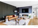 Comfortable living room with a cozy fireplace, mounted television, and modern decor at 2670 6Th St, Boulder, CO 80304