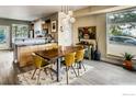 Open dining area featuring hardwood floors and modern pendant lighting at 4661 14Th St, Boulder, CO 80304