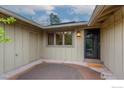 Inviting front entry with stylish door, outdoor lighting, and a welcome mat for guests at 4760 Harrison Ave, Boulder, CO 80303
