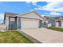 Charming single-Gathering home featuring a two-car garage, well-manicured lawn and professional landscaping at 525 Bonneville Ave, Fort Lupton, CO 80621