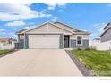 Charming single-Gathering home featuring a two-car garage, well-manicured lawn and professional landscaping at 525 Bonneville Ave, Fort Lupton, CO 80621