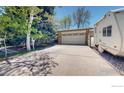 Long driveway leading to a two-car garage and a motor home to the right at 729 Jay Pl, Berthoud, CO 80513