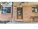 Welcoming front entrance with decorative door and brick facade at 729 Jay Pl, Berthoud, CO 80513