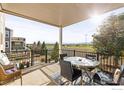 Enjoy outdoor dining on this spacious patio with views of the surrounding community and nearby mountains at 799 Robert St, Longmont, CO 80503