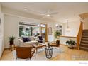 Inviting living area with hardwood floors and views of the outdoor greenery at 1460 Quince Ave # 102, Boulder, CO 80304