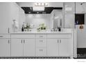 Stylish bathroom featuring double vanity, decorative mirror, and modern shower at 1820 Mary Ln # 16, Boulder, CO 80304