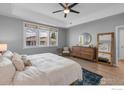 Bright bedroom features three windows, hardwood floors and neutral tones at 1820 Mary Ln # 16, Boulder, CO 80304