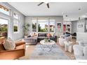 Spacious living room with large windows, ceiling fan, and comfortable seating at 1820 Mary Ln # 16, Boulder, CO 80304