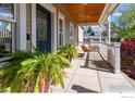 Inviting front porch with porch swing and views of the neighborhood at 227 Mckinley Park Ln, Louisville, CO 80027
