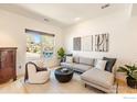Bright living room with large window, comfortable seating, and modern decor at 2302 Spruce St, Boulder, CO 80302