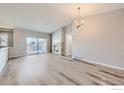 Spacious living room with vaulted ceilings, wood floors and natural light at 2435 Calais Dr # B, Longmont, CO 80504