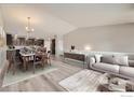 Open concept living room and kitchen with modern finishes and ample space for entertaining at 2435 Calais Dr # B, Longmont, CO 80504