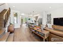 Open-concept living space with hardwood floors, modern kitchen, and ample natural light at 2907 32Nd St, Boulder, CO 80301