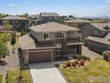 Stunning curb appeal with a well-maintained lawn, two-car garage, and tasteful landscaping around this two-story home at 4780 W 108Th Pl, Westminster, CO 80031