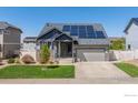 Charming home with solar panels, landscaping and a welcoming front porch at 5659 Viewpoint Ave, Firestone, CO 80504