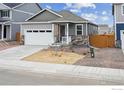 Charming single-Gathering home showcasing stone accents, attached garage, and manicured landscaping at 6500 13Th St, Frederick, CO 80530