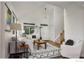 Bright living room featuring high ceilings, large windows, and stylish contemporary furnishings at 6646 Bean Mountain Ln, Boulder, CO 80301