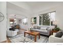 Comfortable living room with hardwood floors, large windows, and open-concept design at 6646 Bean Mountain Ln, Boulder, CO 80301